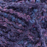 Swatch of Bernat Tweedie yarn in shade rhapsody (dark purple/blue shades colourway with tweed like texture)