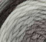 Swatch of Bernat Pop! yarn in shade ebony and ivory (white, light to dark grey ombre, black colourway)