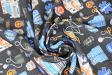 Swirled swatch paramedic black fabric (black fabric with small tossed full colour paramedic themed emblems: orange stretchers, blue vests and hats, "EMT/EMS" badges and text, blood pressure cuffs, scissors, etc.)