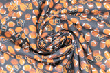 Swirled swatch footballs black fabric (black fabric with small tossed brown footballs allover and orange/black number/letter signs)