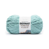 A ball of Bernat Forever Fleece yarn in shade Dark Eucalyptus (pale light teal/turquoise)
