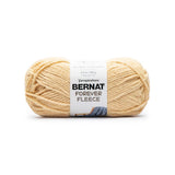 A ball of Bernat Forever Fleece yarn in shade Chamomile (soft yellow)