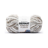 A ball of Bernat Forever Fleece yarn in shade Latte (multi coloured yarn with white, grey, beige and greige shades)