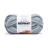 A ball of Bernat Symphony yarn in shade Sea Spray (white, pale blues and mint green in twisted shades)