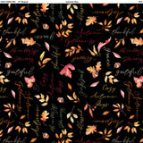 Square swatch Thankful Black fabric (black fabric with tossed red, orange and yellow autumn leaves in various styles, tossed acorns, and tossed autumn related text in cursive: red, orange, yellow, green text both horizontally and vertically "Autumn" "Gatherings" etc text)