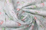 Swirled swatch owls fabric (palest blue fabric with tossed cartoon owls in various poses wearing pjs in blue, green and pink with tossed branches and leaves)