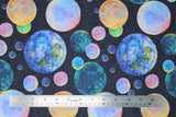 Flat swatch planets fabric (dark blue space sky background with tiny white star dots allover and tossed circular planets in various sizes and colours)