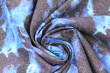 Swirled swatch celestial unicorn fabric (dark blue/purple night sky look fabric with tiny white star dots and light blue organic form unicorn shapes)