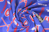 Swirled swatch NHL printed fabric in Montreal Canadiens (multi logo on blue)
