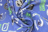 Swirled swatch NHL printed fabric in Vancouver Canucks (multi logo on blue)