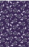 Floral Cluster Toss fabric swatch (purple fabric with tossed white and purple small floral clusters with leaves, background has tiny light purple dots)