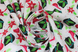 Swirled swatch Bird & Hat fabric (white fabric with tossed red cardinal birds, tossed white and red floral and greenery, and tossed black helmet look hats with holly)
