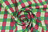 Swirled swatch Plaid fabric (white, greens, and red plaid in small squares)