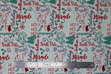 Flat swatch Words fabric (white fabric with horizontal and vertical cursive christmas themed words allover in red, green and navy: "Ho Ho Ho" "Miracle" "North pole" etc. with small red and green emblems: snowflakes and holly, trees, etc.)
