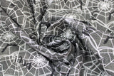 Swirled swatch Webs fabric (grey marbled look fabric with white spider webs allover and black spiders and bats with black "BOO!" text)
