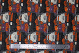 Flat swatch Pumpkin Patch fabric (grey fabric with white, purple and black trucks allover with pumpkins in the beds and tossed jack-o-lanterns allover)