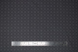 Flat swatch fireworks fabric (dark grey fabric with light grey concentric circle dot pattern in small and medium)