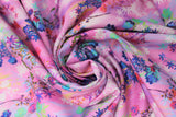 Swirled swatch bright floral print in peony (light pink and pastel colours marbled fabric with tossed floral designs with stems in bright blues/purples/pinks/white print allover)