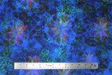 Flat swatch venice lawns fabric in blue (medium/deep blue marbled fabric with floral kaleidoscope style design in blue, green, pink)