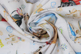 Swirled swatch dog themed fabric print think pawsitive in white (white fabric with assorted dogs, dog houses and beds, bones, balls, leashes, collars, in various colours)