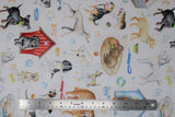 Flat swatch dog themed fabric print think pawsitive in white (white fabric with assorted dogs, dog houses and beds, bones, balls, leashes, collars, in various colours)