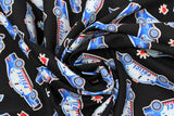 Swirled swatch emergency services themed print fabric in police (black fabric with white/blue/red police cars and lit cherries)