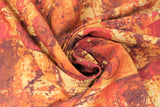 Swirled swatch orange fabric (abstract paint look fabric on orange in light to dark yellow and orange shades with various textures, shapes and circles)