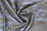 Swirled swatch blue and black fabric (abstract paint look fabric on black with dark blue stripe like abstract shapes)