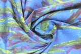 Swirled swatch blue and green fabric (abstract paint look fabric on medium blue with dark blue and light green stripe like abstract shapes)