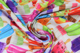 Swirled swatch popsicles fabric (white fabric with tossed popsicles in various colours with wooden sticks, pink, purple, orange, green colourway)