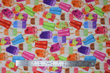 Flat swatch popsicles fabric (white fabric with tossed popsicles in various colours with wooden sticks, pink, purple, orange, green colourway)