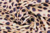 Swirled swatch cheetah print fabric (pale gold/yellow fabric with black cheetah stripes and fur look texture)