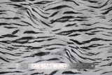 Flat swatch white tiger print fabric (white fabric with black stripes and fur look texture)