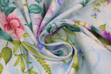 Swirled swatch Light Blue fabric (light blue and white marbled look fabric with white silhouette floral and tossed pink and purple floral heads with green leaves and greenery)