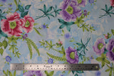 Flat swatch Light Blue fabric (light blue and white marbled look fabric with white silhouette floral and tossed pink and purple floral heads with green leaves and greenery)