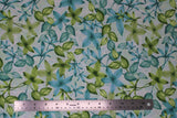 Flat swatch Green fabric (white fabric with busy tossed pointy floral heads and leaves in blue and green)