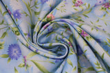 Swirled swatch Lilac fabric (white and sky blue marbled look fabric with loosely tossed floral and stems, greenery allover in green, white, blue, purple and pink)