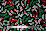 Flat swatch socks fabric (black fabric with tossed Christmas socks and stockings allover in various styles/colours in red, green, white, grey with candy canes, trees, deer, etc. patterns)