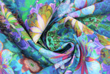 Swirled swatch venice lawns fabric in green (medium/deep green blue marbled fabric with floral kaleidoscope style design in blue, green, pink, yellow)
