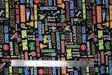 Flat swatch Work Zone fabric (black fabric with tossed cartoon style tools in full colour with work related text allover in multi directions "Hard Hat" "Caution" "Do Not Enter" etc. all in bright colours)