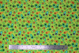 Flat swatch printed fabric from the Chili Smiles line in sprout (bright green fabric with tossed cartoon happy avocado halves in various green shades)