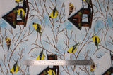Flat swatch snowy birdhouse fabric (white and light blue marbled snowy sky look fabric with tossed brown snow covered birdhouses with yellow birds and snow covered branches throughout)