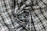 Swirled swatch Plaid fabric (white, black and grey diagonal plaid lines)