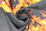 Swirled swatch fire stripes fabric (black fabric with lines/stripes of realistic looking orange and yellow flames)