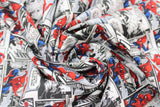 Swirled swatch comic packed fabric (white fabric with varying size rectangular comic panels with Spiderman graphics, and "This looks like a job for Spider-Man!" text)