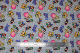 Flat swatch Go Mario & Friends fabric (grey distressed look fabric with tossed full colour characters in speedy positions Peach, Toad, Luigi, and Mario with tossed 'Super Mario 3' writing in blue, turtle foes, white running clouds)