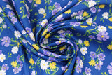 Swirled swatch navy toss fabric (navy fabric with small tossed wildflower floral in white, purple, yellow floral heads with green stems/leaves)