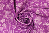 Swirled swatch violet layered fabric (magenta purple fabric with light purple/white tossed floral outlines allover)