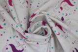 Swirled swatch Beautiful Unicorn fabric (white fabric with small closed-eyed drawn style unicorns with pink manes and purple manes outlined in pink, purple, and blue stars and hearts making circle shapes around heads)