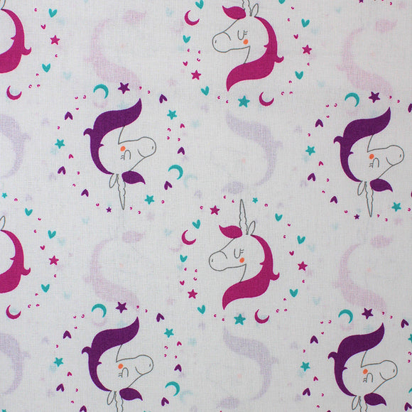 Square swatch Beautiful Unicorn fabric (white fabric with small closed-eyed drawn style unicorns with pink manes and purple manes outlined in pink, purple, and blue stars and hearts making circle shapes around heads)